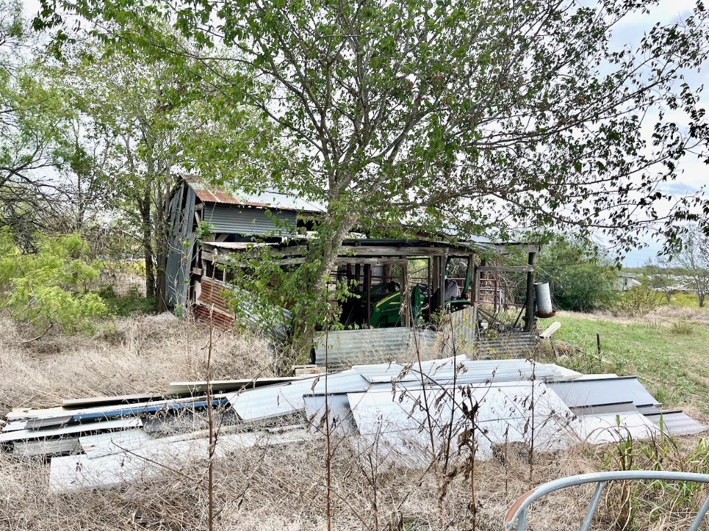 11604 Moore Road Austin, TX 78719 - Photo 12 of 19 a view of a backyard with large trees