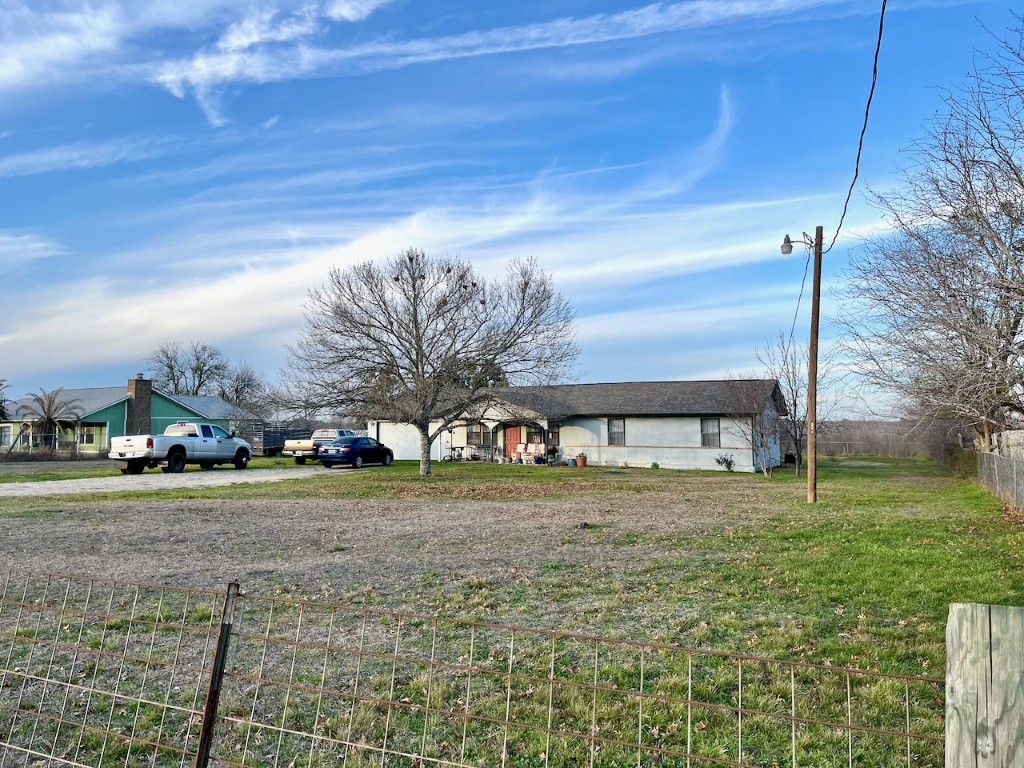 11604 Moore Road Austin, TX 78719 - Photo 17 of 19 a view of a yard in front of a house