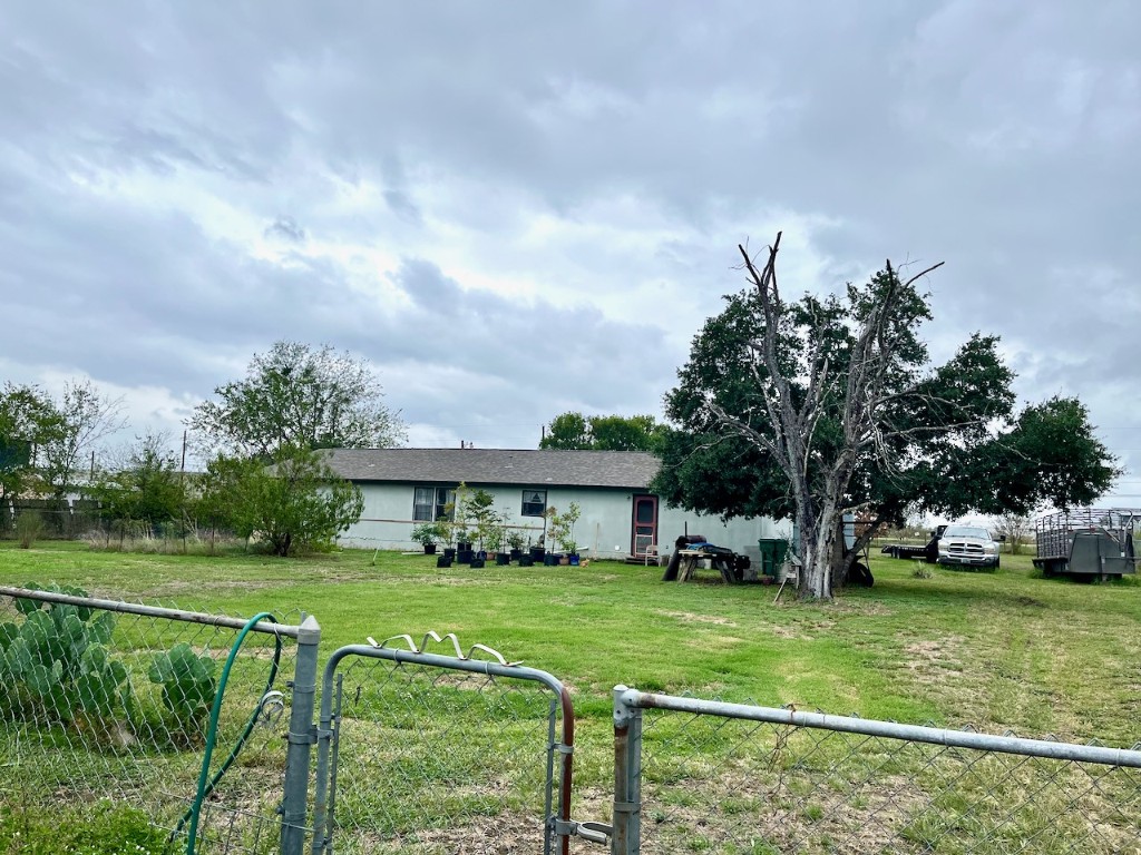 11604 Moore Road Austin, TX 78719 - Photo 9 of 19 a view of a house with a big yard plants and trees