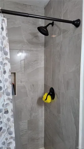 a bathroom with a toilet a sink and shower