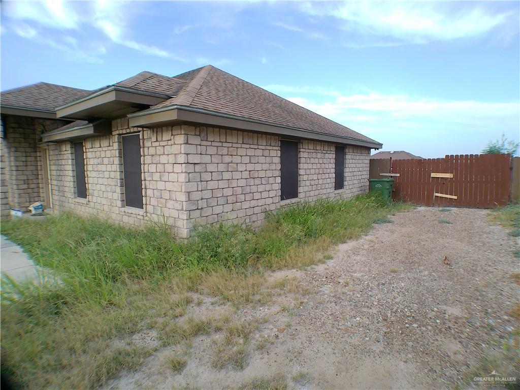 191 Teodora Drive Rio Grande City, TX 78582 - Photo 2 of 45 a front view of a house with a garden
