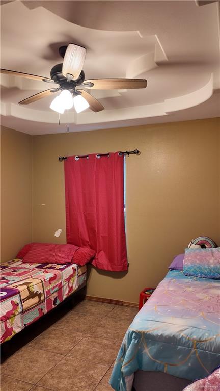 191 Teodora Drive Rio Grande City, TX 78582 - Photo 24 of 45 a bedroom with a bed and curtain
