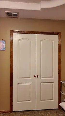 a bathroom with a sink mirror vanity and toilet