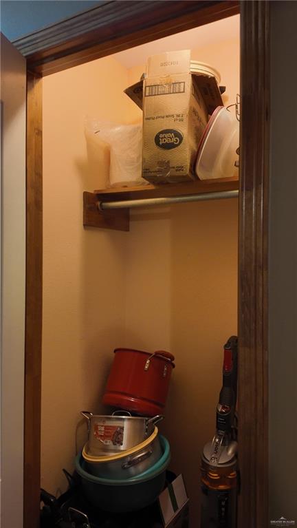 191 Teodora Drive Rio Grande City, TX 78582 - Photo 30 of 45 a room with a chair and wooden floor