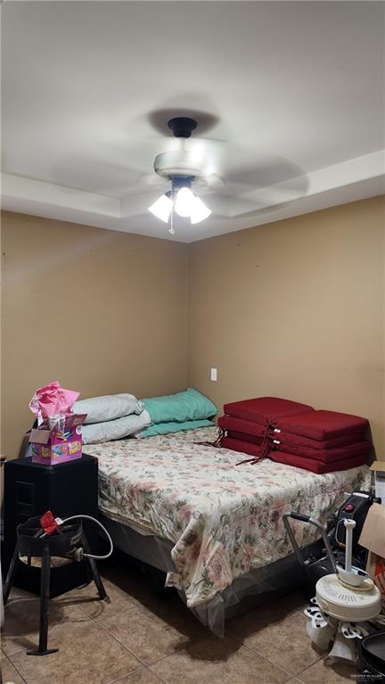 191 Teodora Drive Rio Grande City, TX 78582 - Photo 31 of 45 a bedroom with a bed and a chandelier