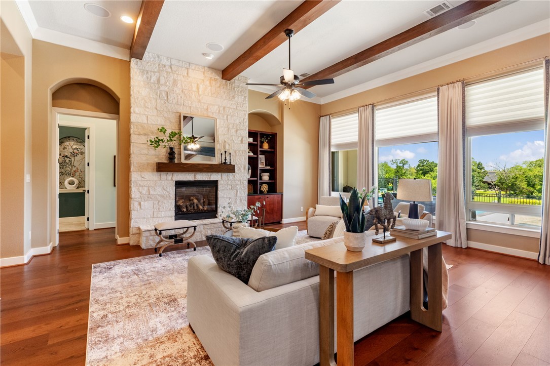 2833 Persimmon Ridge Court Bryan, TX 77807 - Photo 25 of 50 a living room with fireplace furniture and a large window