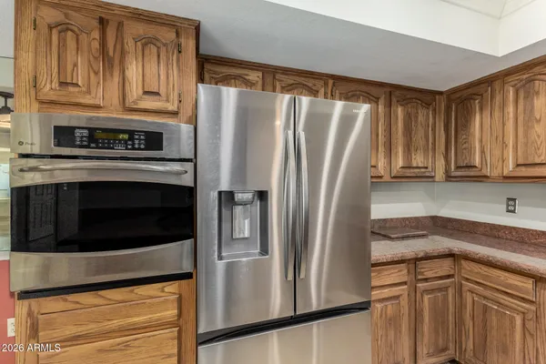 a kitchen with cabinets appliances and a sink