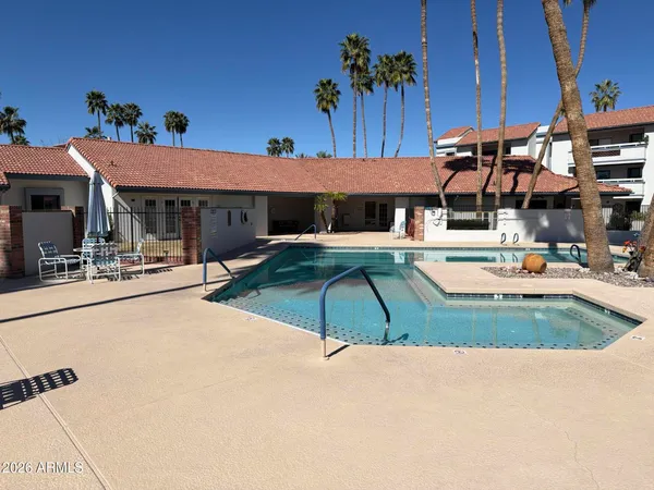 a view of a swimming pool with a patio
