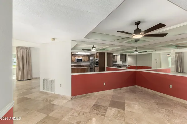 a large kitchen with stainless steel appliances granite countertop a stove and a sink