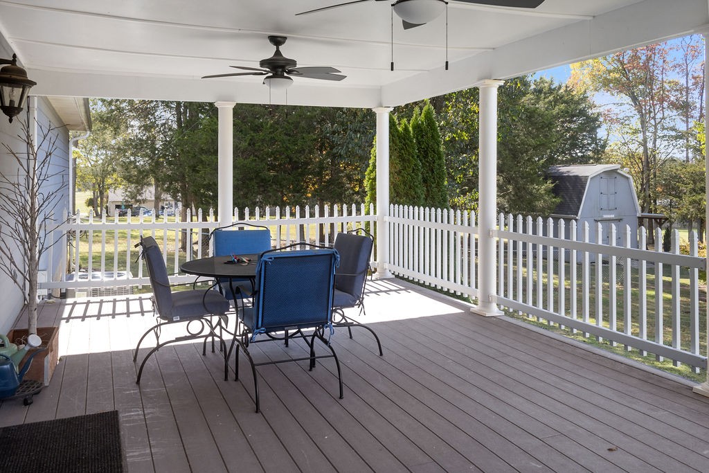 758 Holt Road Lebanon, TN 37087 - Photo 18 of 55 a view of a patio with a table chairs and wooden floor