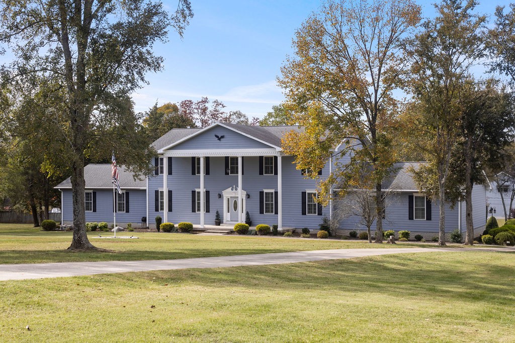 758 Holt Road Lebanon, TN 37087 - Photo 2 of 55 a front view of a house with swimming pool and yard