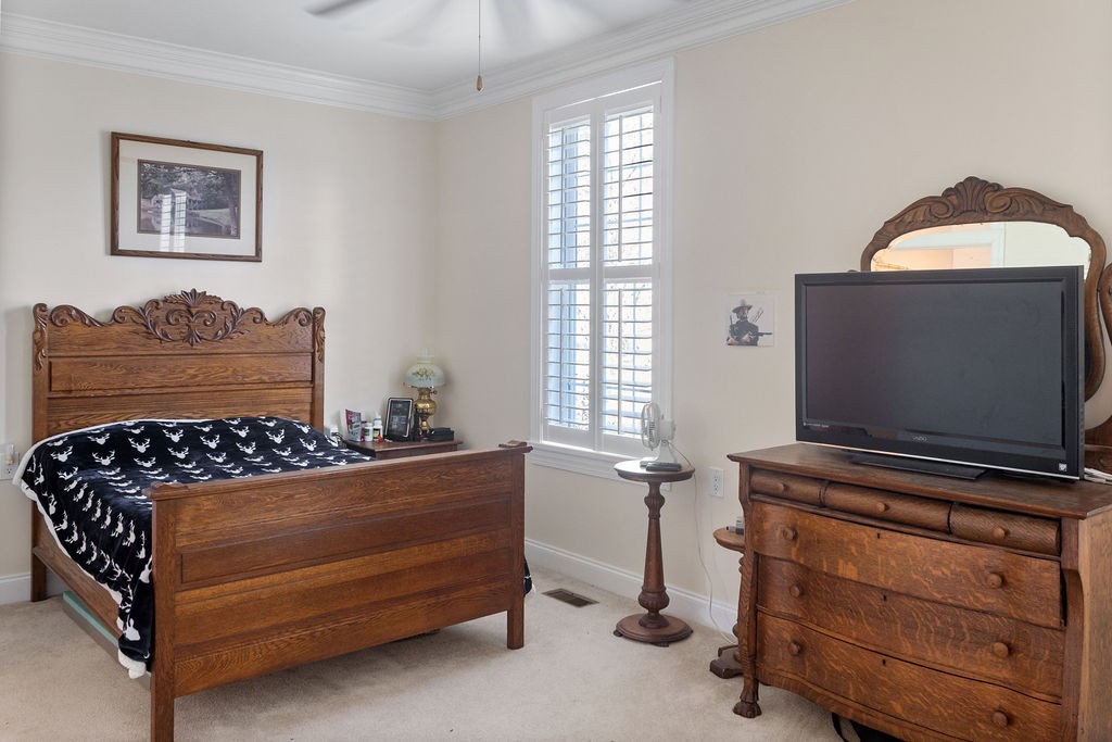 758 Holt Road Lebanon, TN 37087 - Photo 24 of 55 a bedroom with a bed and a flat screen tv