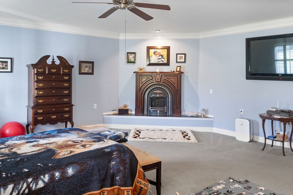758 Holt Road Lebanon, TN 37087 - Photo 29 of 55 a bedroom with a bed and a chandelier
