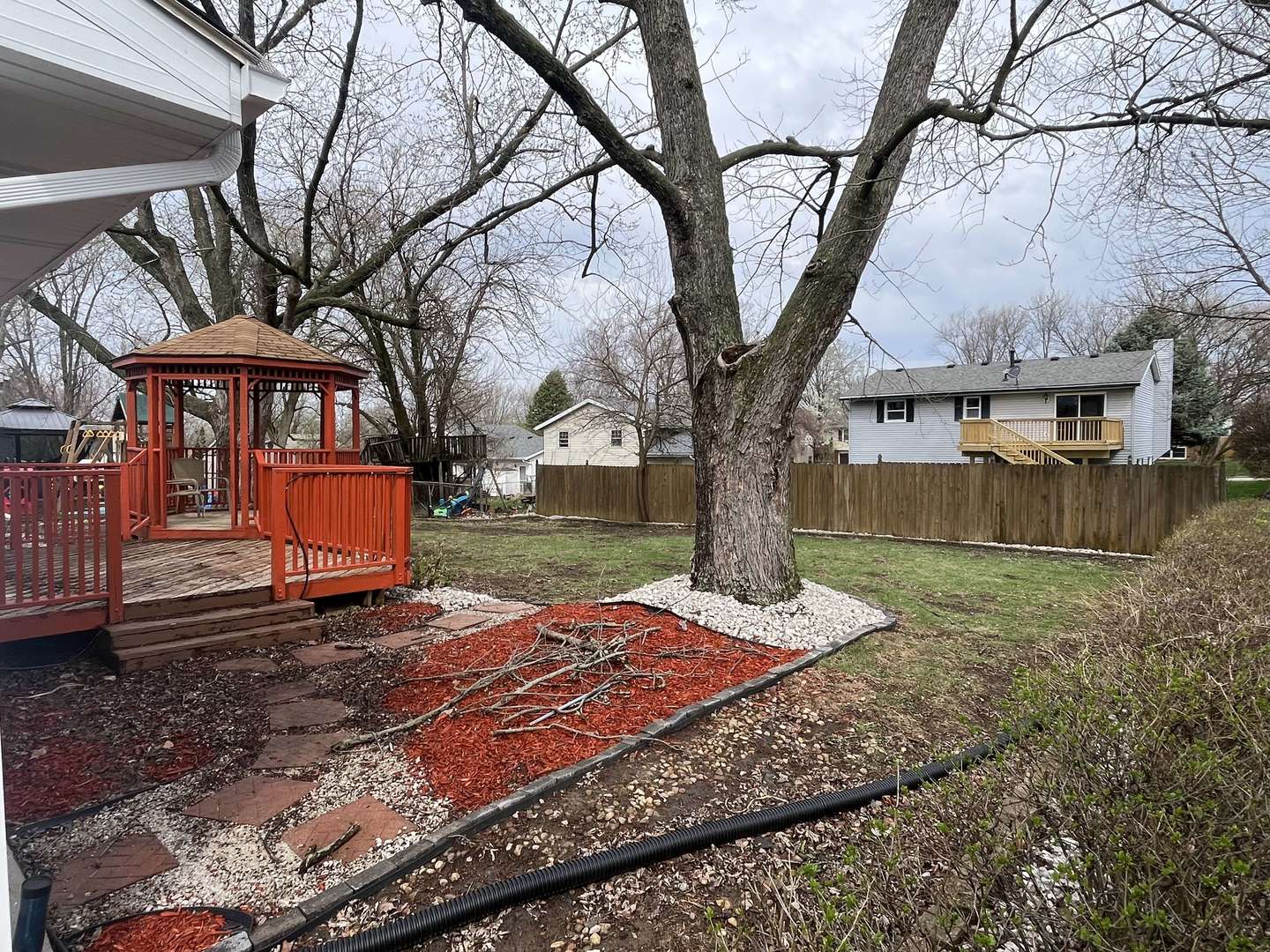 1720 Jacobssen Drive Normal, IL 61761 - Photo 13 of 13 a backyard of a house with barbeque oven and outdoor seating