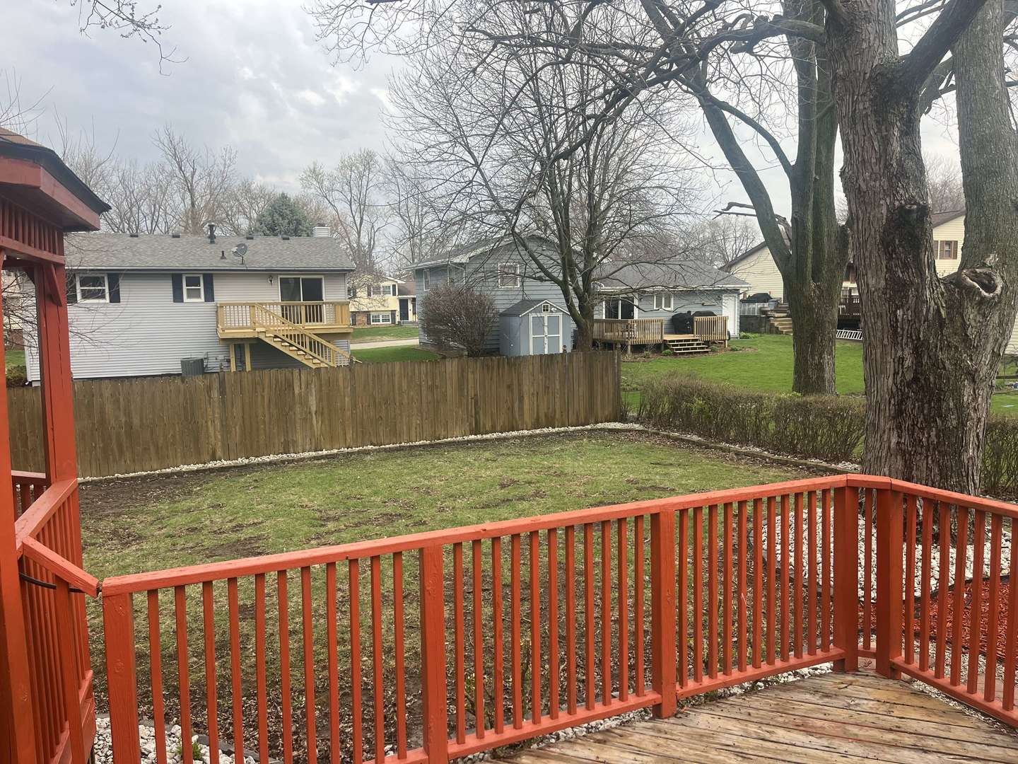 1720 Jacobssen Drive Normal, IL 61761 - Photo 2 of 13 a view of a wooden fence and a trees in the background