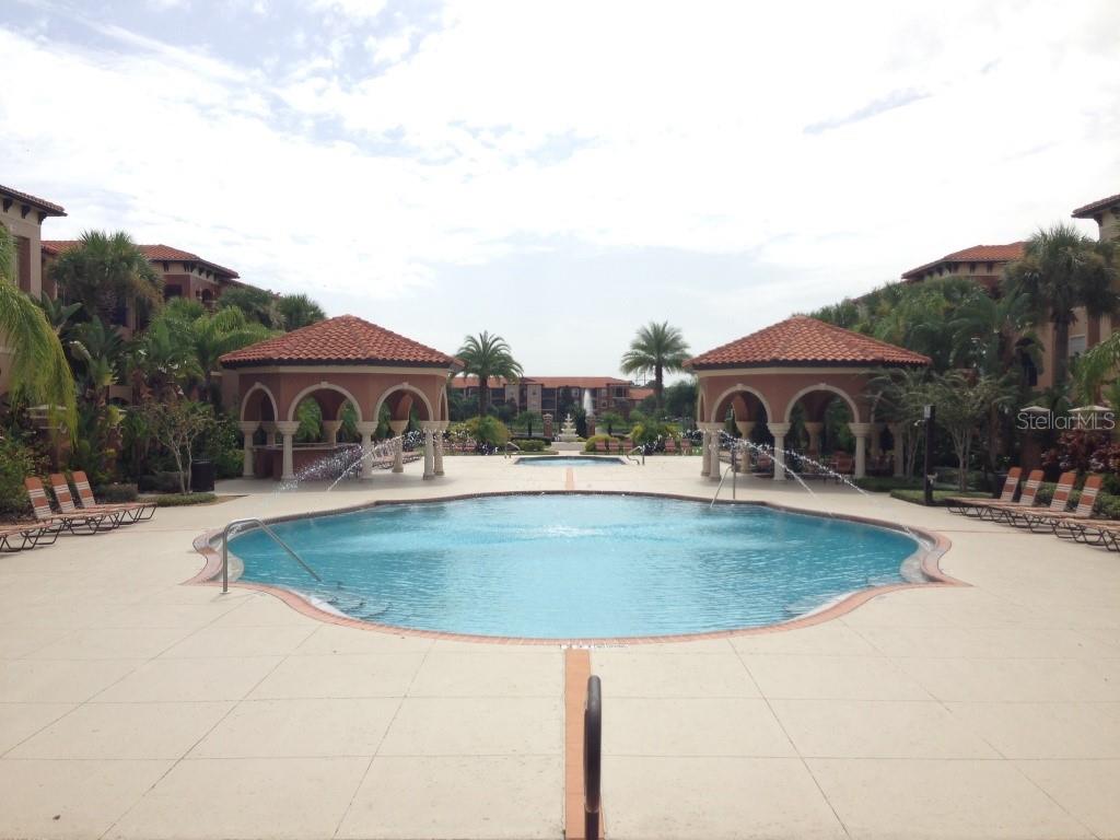 5512 Metrowest Boulevard, Unit 304 Orlando, FL 32811 - Photo 12 of 12 a backyard of a house with yard fire pit and outdoor seating