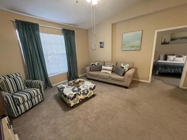 a living room with furniture and a window