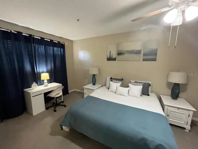 a bed room with a bed and a lamp