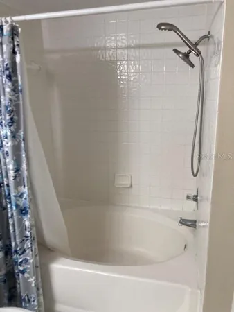 a close view of a bathtub in bathroom