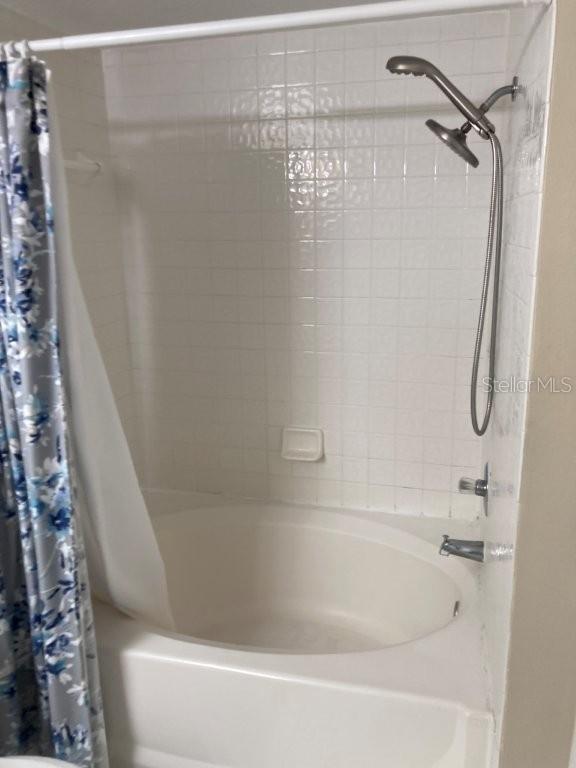5512 Metrowest Boulevard, Unit 304 Orlando, FL 32811 - Photo 9 of 12 a close view of a bathtub in bathroom