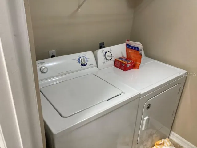 a utility room with dryer and washer