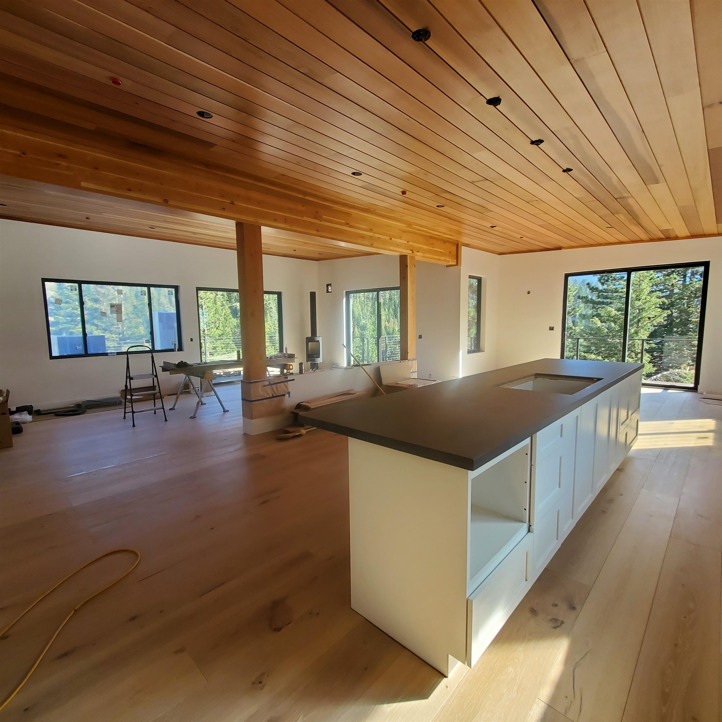 1423 Juniper Mountain Road Alpine Meadows, CA 96146 - Photo 3 of 8 a kitchen with stainless steel appliances granite countertop a sink and wooden floors