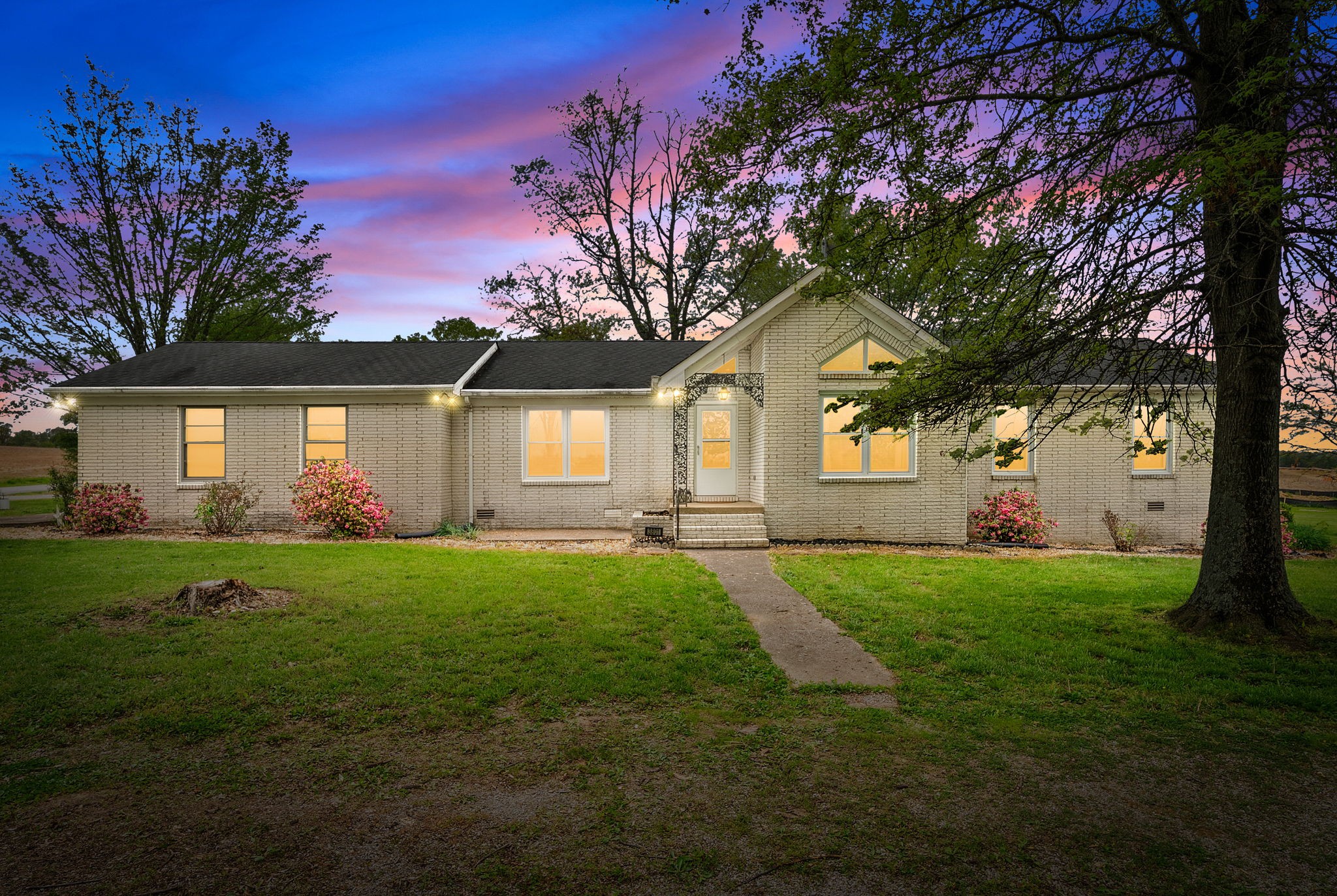 a front view of a house with a yard