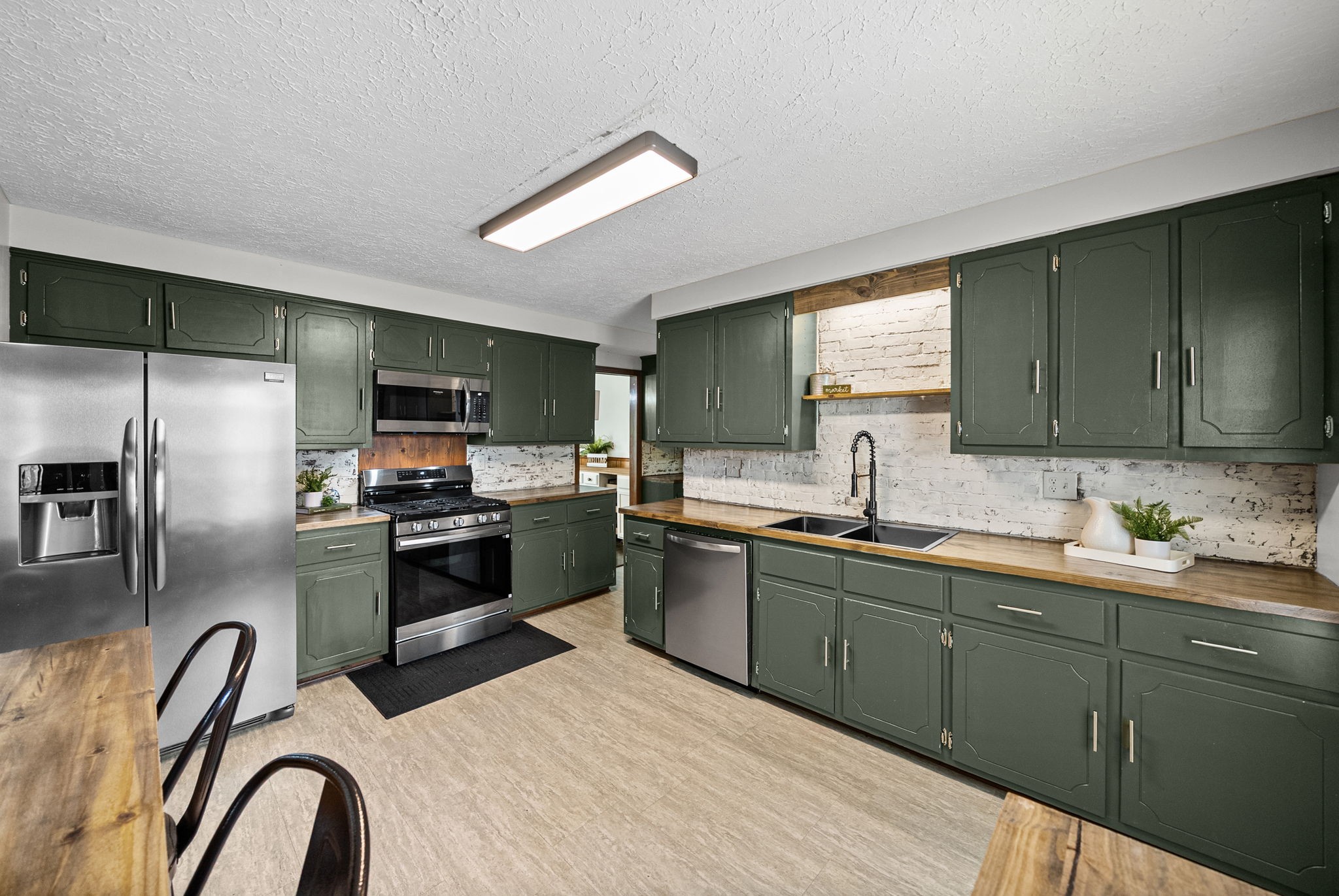 3801 Allegre Road Elkton, KY 42220 - Photo 11 of 36 a kitchen with a sink stainless steel appliances and cabinets