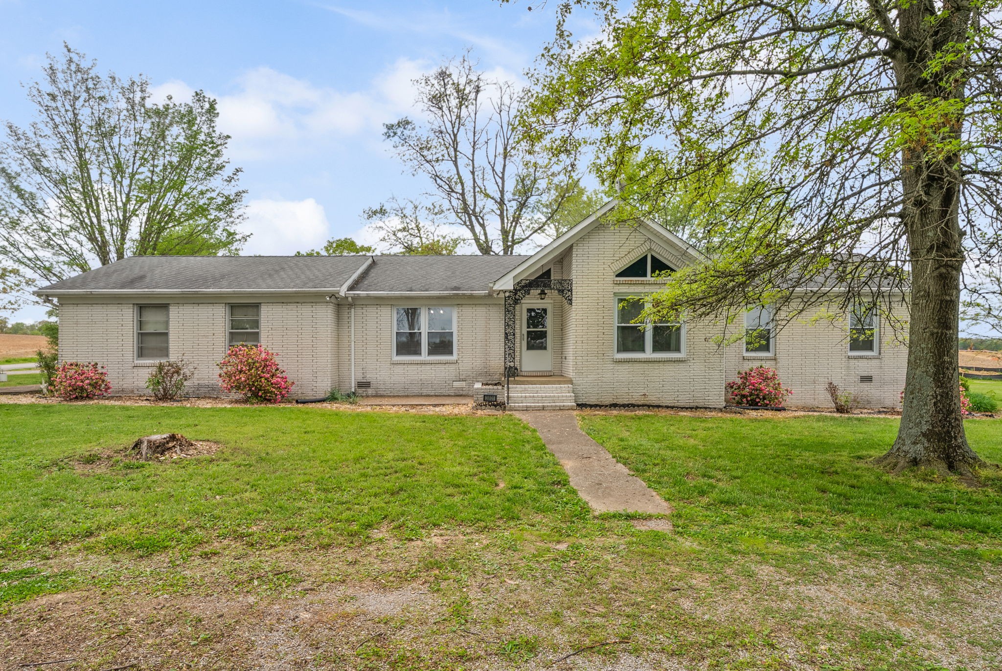 3801 Allegre Road Elkton, KY 42220 - Photo 25 of 36 a front view of a house with a yard and trees