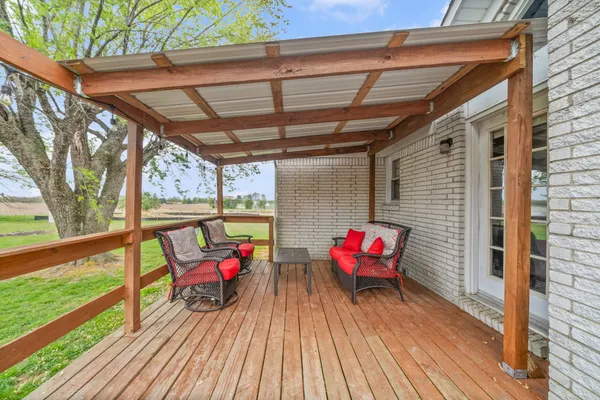 a view of a deck with a yard