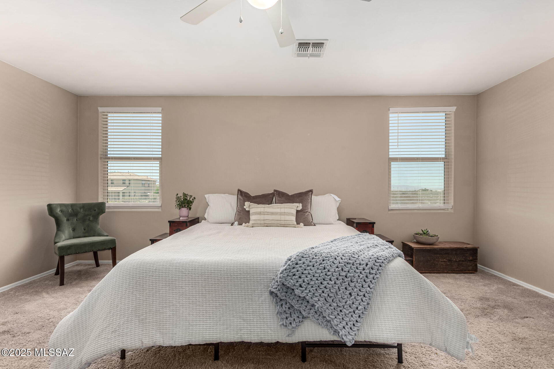 9528 Desert Fauna Loop Tucson, AZ 85747 - Photo 24 of 46 a bedroom with a bed and chair