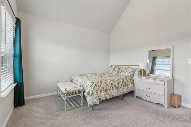 a bedroom with a bed and a cabinets