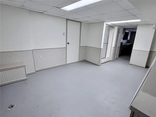 a view of an empty room with closet