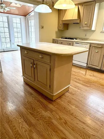 a kitchen with stainless steel appliances granite countertop a sink and a stove