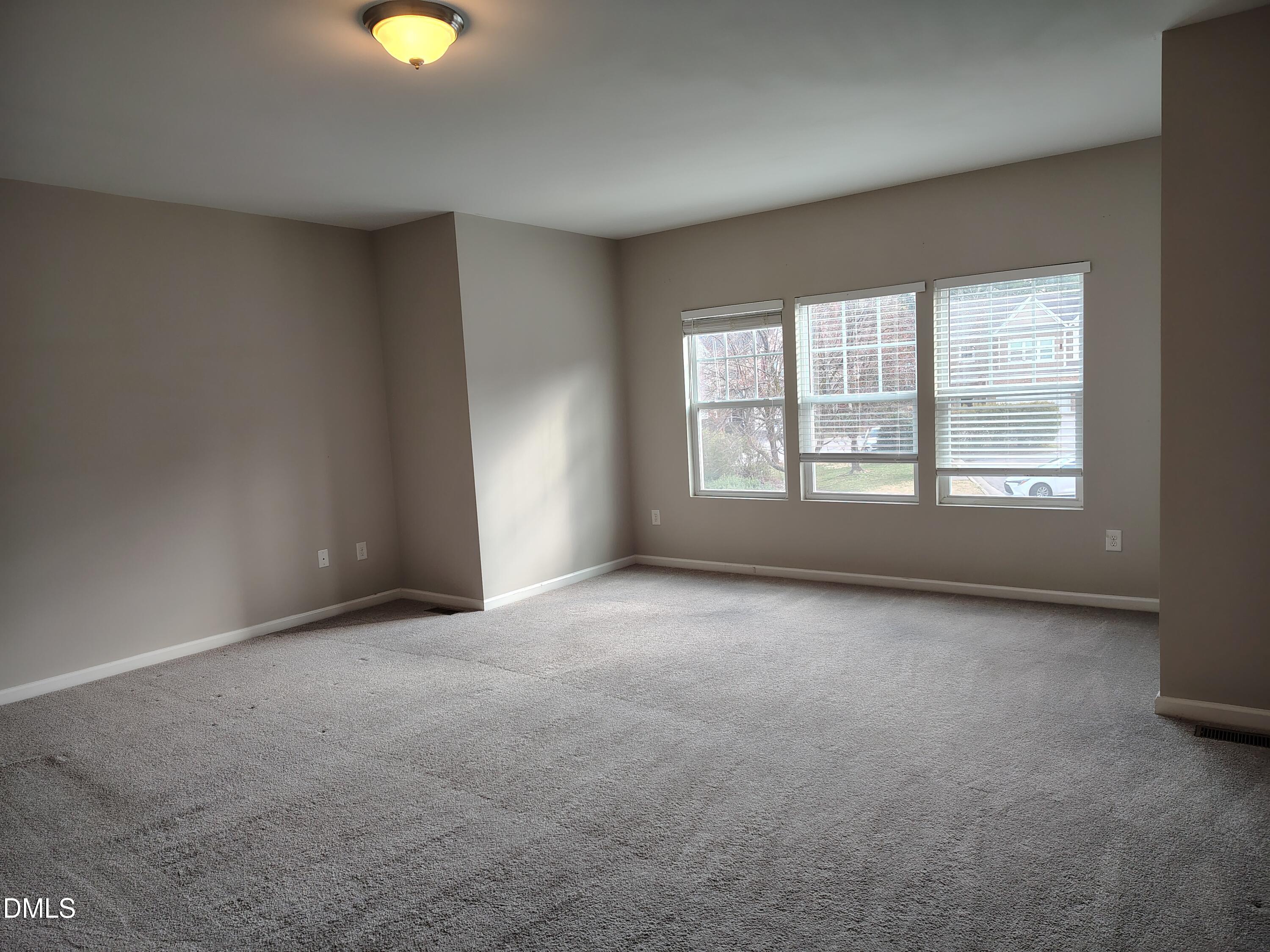 831 Davidson Point Road Cary, NC 27513 - Photo 11 of 22 an empty room with window