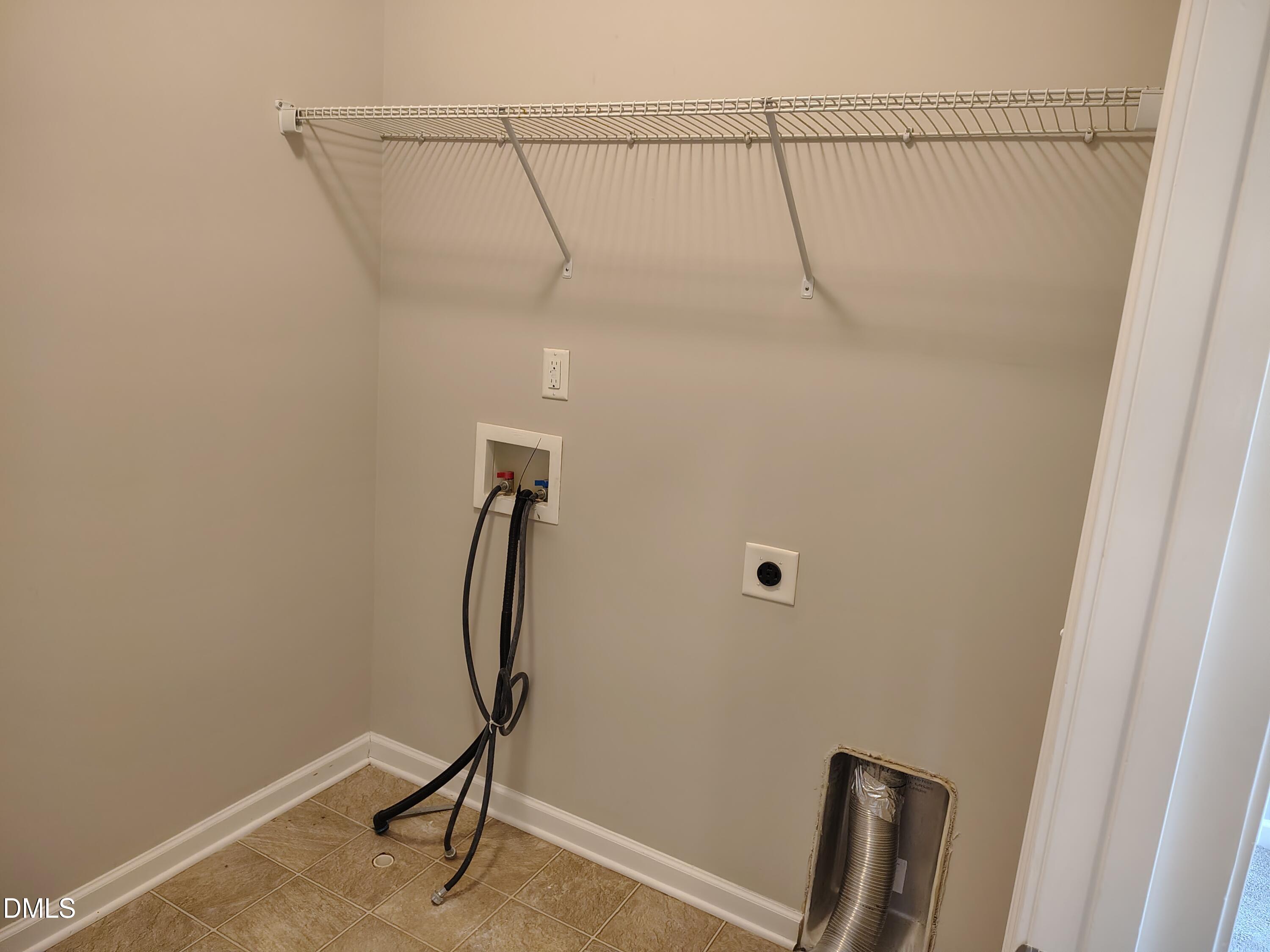 831 Davidson Point Road Cary, NC 27513 - Photo 16 of 22 a room with gym equipment and wooden floor