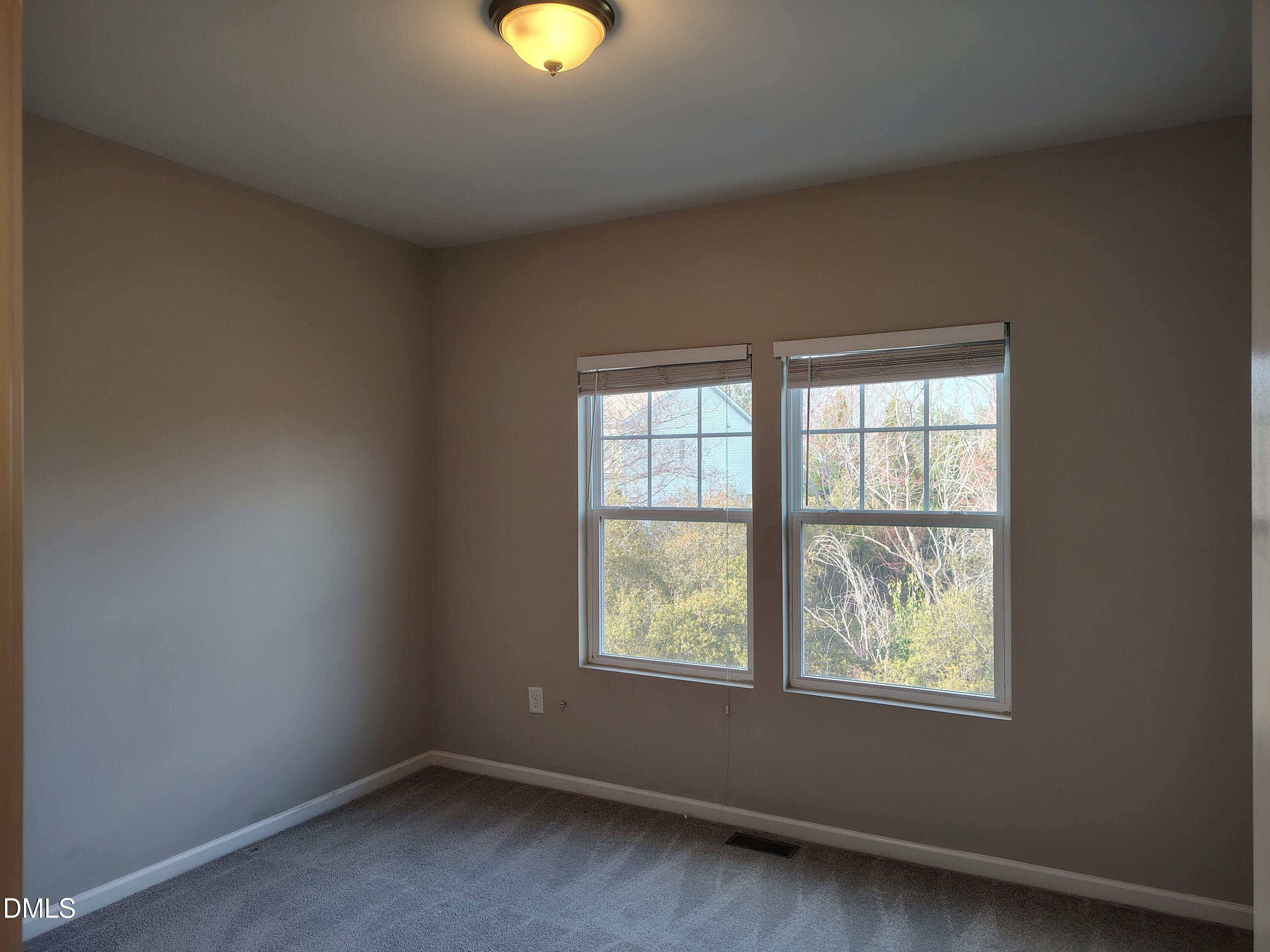 831 Davidson Point Road Cary, NC 27513 - Photo 18 of 22 an empty room with windows