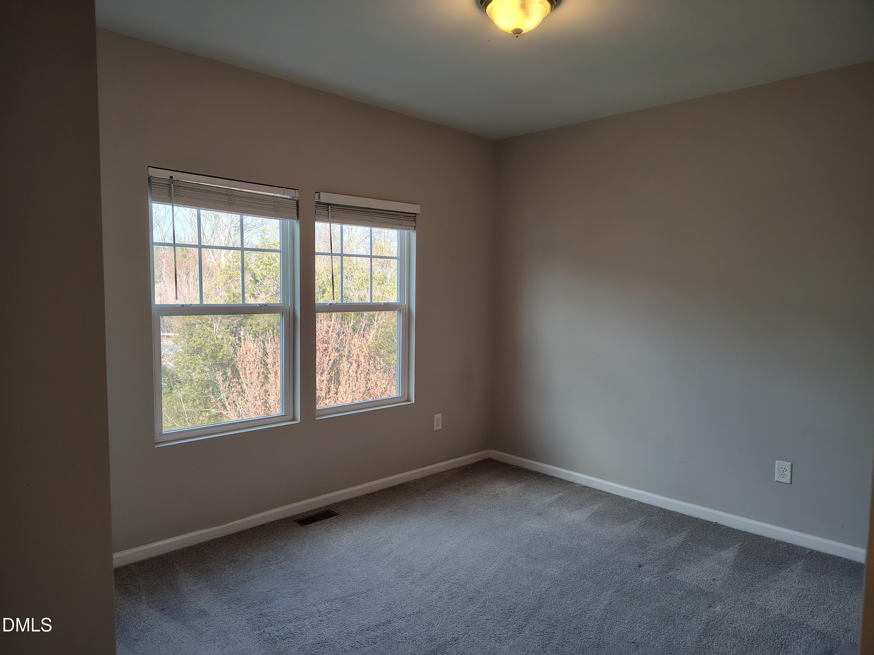 831 Davidson Point Road Cary, NC 27513 - Photo 19 of 22 an empty room with a window