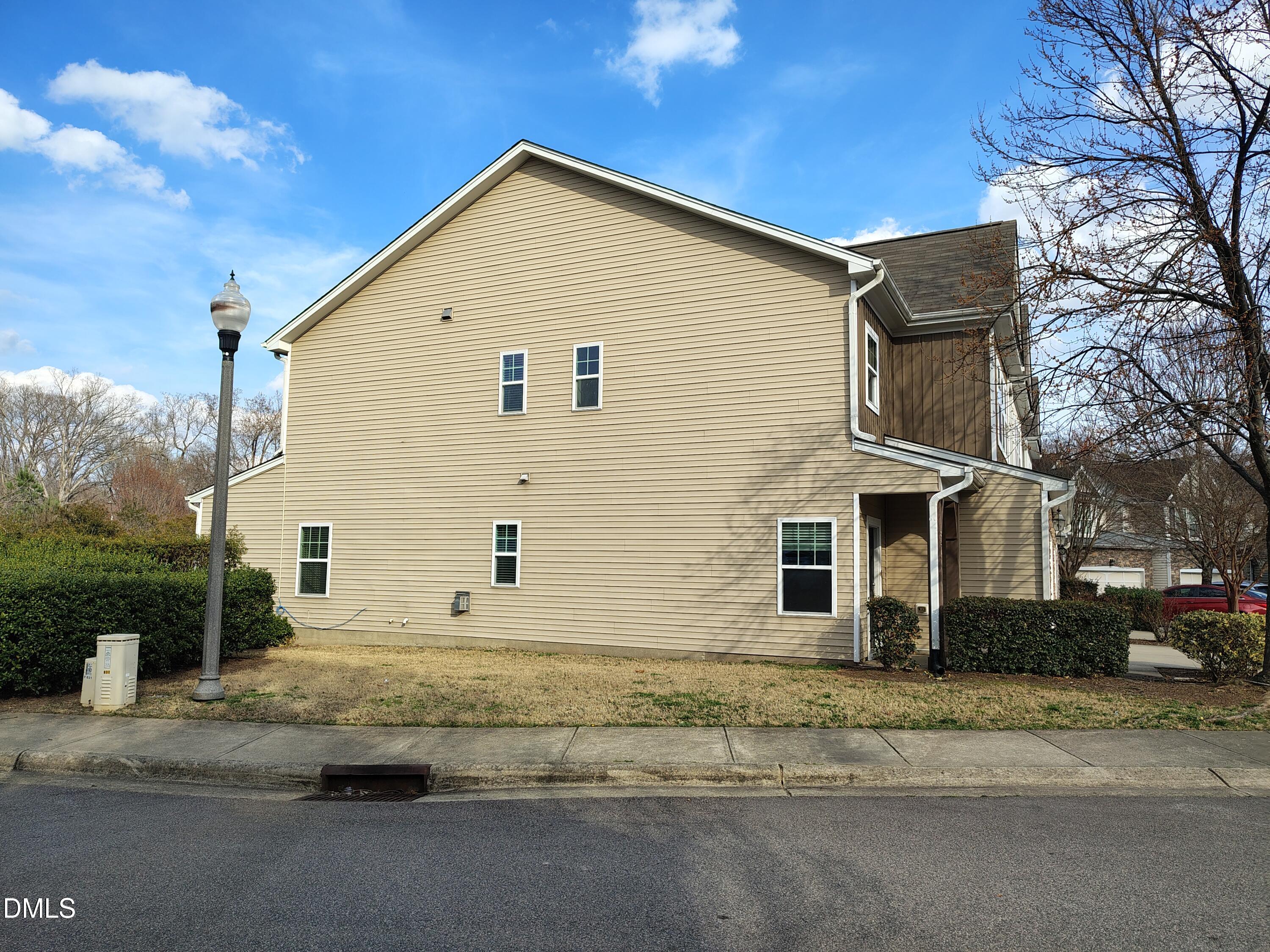 831 Davidson Point Road Cary, NC 27513 - Photo 20 of 22 a view of a white house with a large space