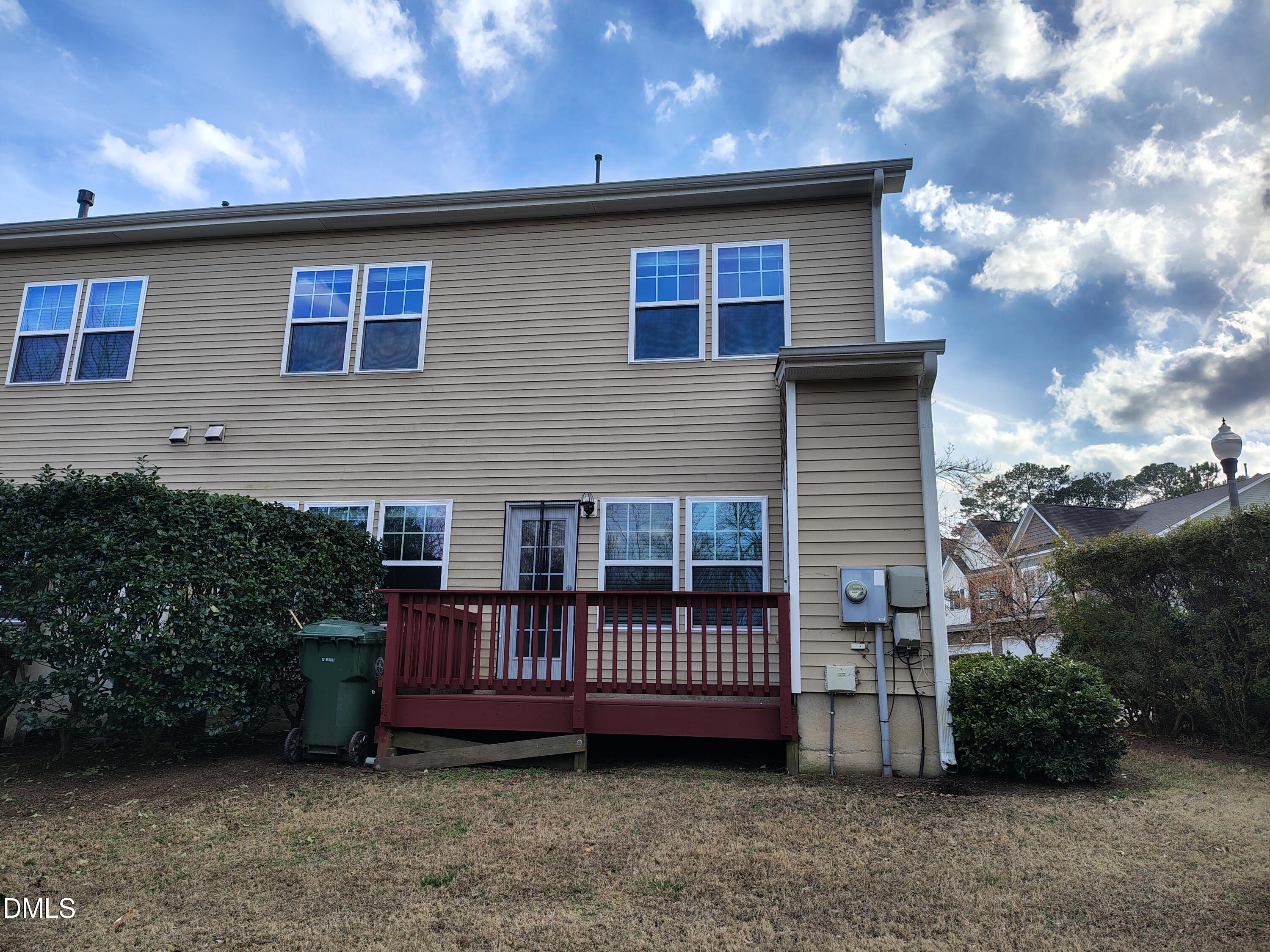 831 Davidson Point Road Cary, NC 27513 - Photo 21 of 22 a view of a house with wooden deck and backyard