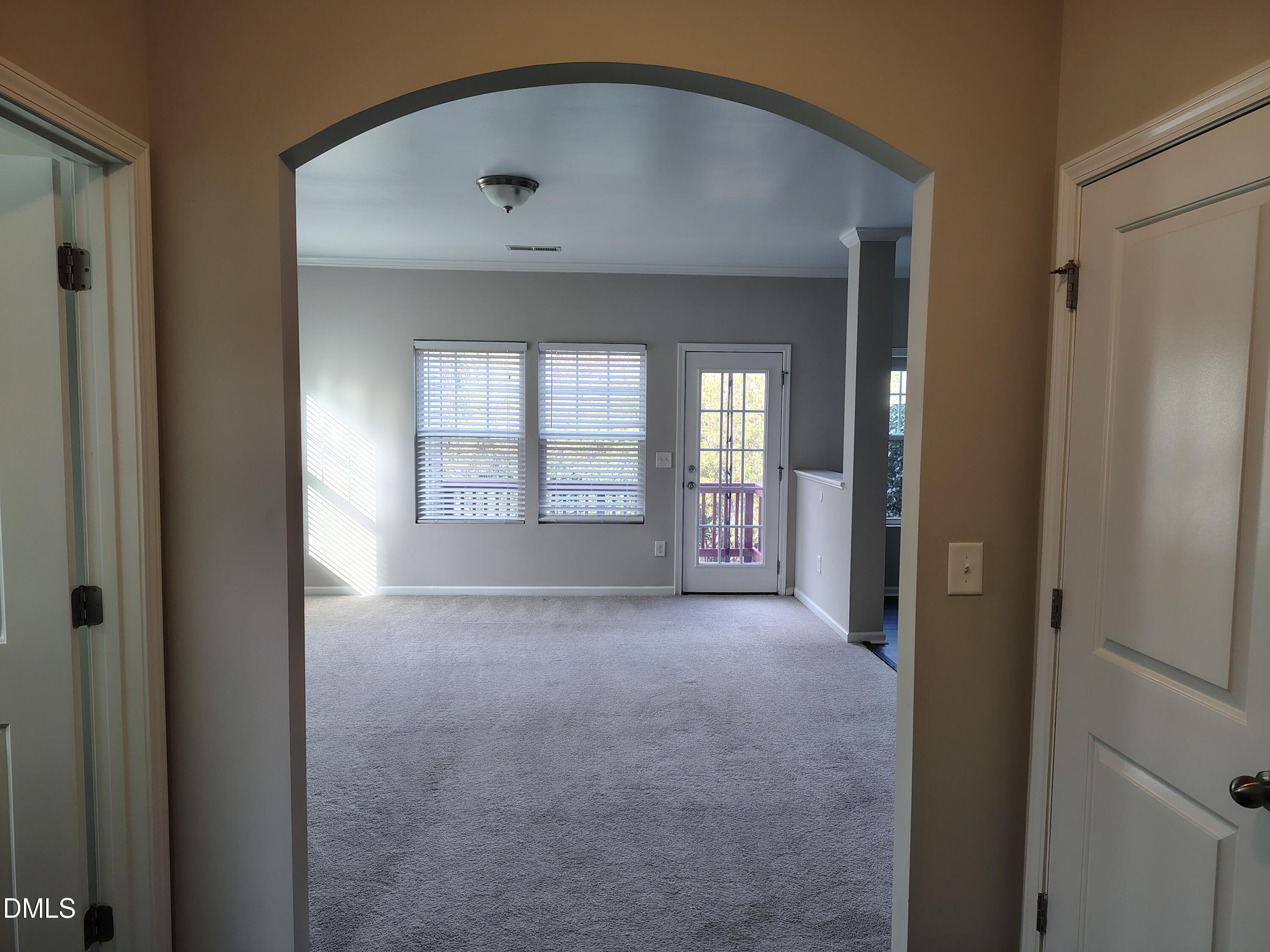 831 Davidson Point Road Cary, NC 27513 - Photo 3 of 22 an empty room that has a window in it