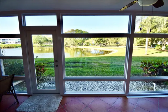 a view of wooden floor and a window