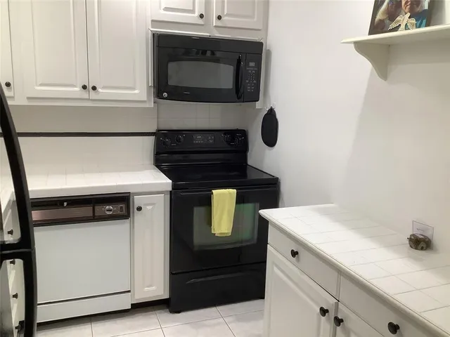 a kitchen with a stove and a microwave