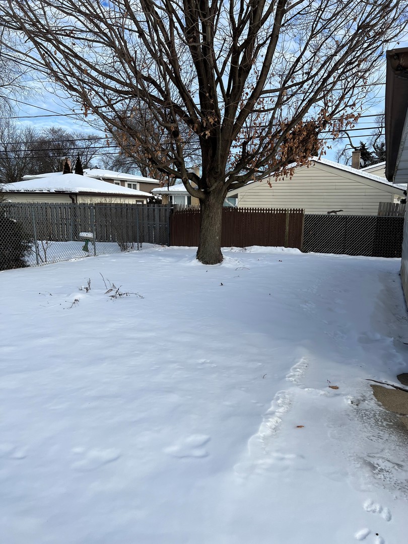 1171 South Ridge Avenue Arlington Heights, IL 60005 - Photo 12 of 12 a view of house with a snow on the road