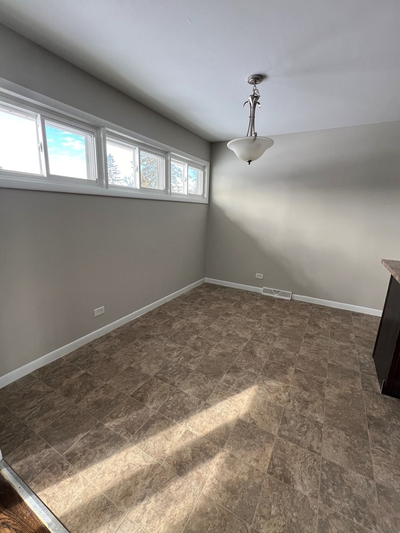 1171 South Ridge Avenue Arlington Heights, IL 60005 - Photo 4 of 12 a view of empty room with window