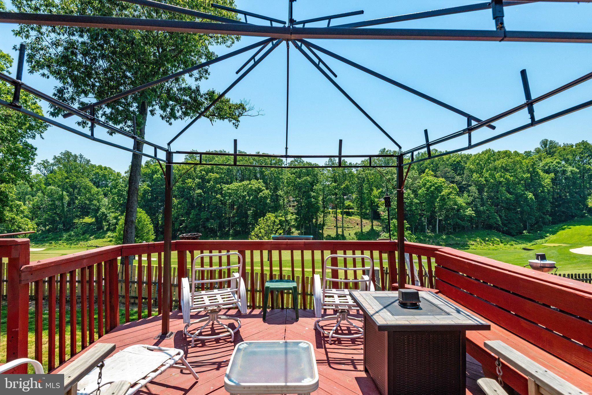 7905 Jansen Court Springfield, VA 22152 - Photo 4 of 26 a view of a deck with wooden floor and outdoor seating