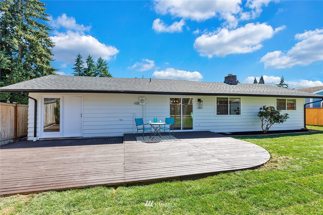 2212 Edmonds Avenue Northeast Renton, WA 98056 - Photo 17 of 18 a front view of a house with a garden and yard