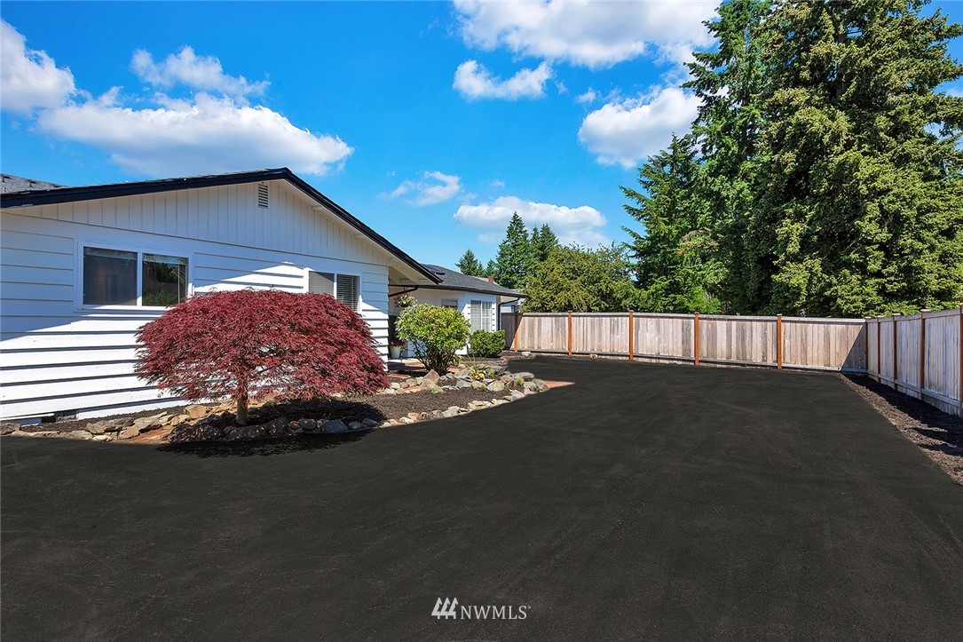 2212 Edmonds Avenue Northeast Renton, WA 98056 - Photo 4 of 18 a front view of a house with a garden