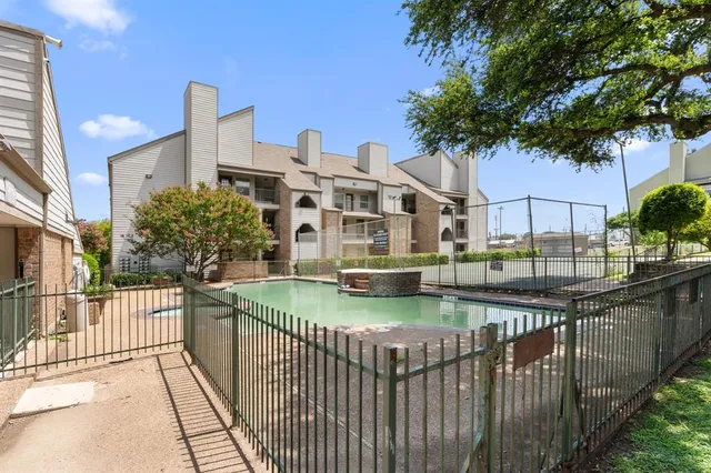 a view of swimming pool from a balcony