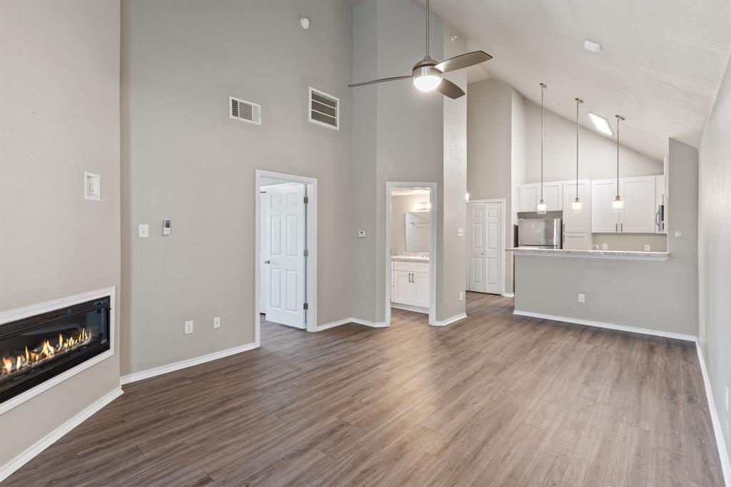 6108 Abrams Road, Unit 521 Dallas, TX 75231 - Photo 10 of 31 a view of a kitchen with wooden floor and a kitchen